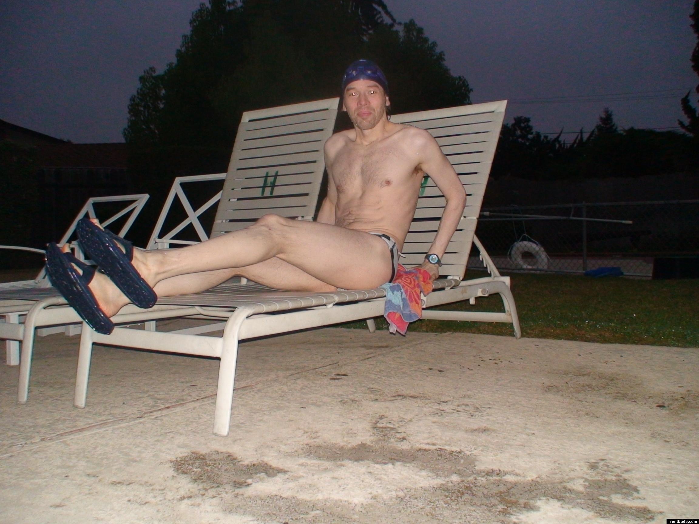 Sitting in a lounge chair in a polka dot speedo