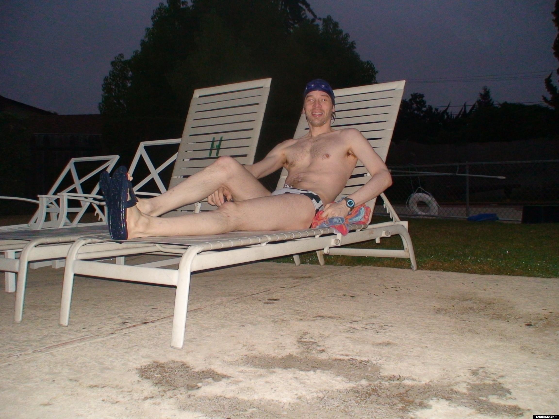 Sitting in a lounge chair in a polka dot speedo
