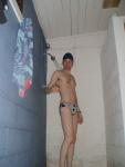 In the shower wearing a polkadot water polo speedo (chest hair)