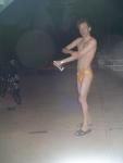 Putting anti-chlorine lotion on before a swim (yellow speedo)