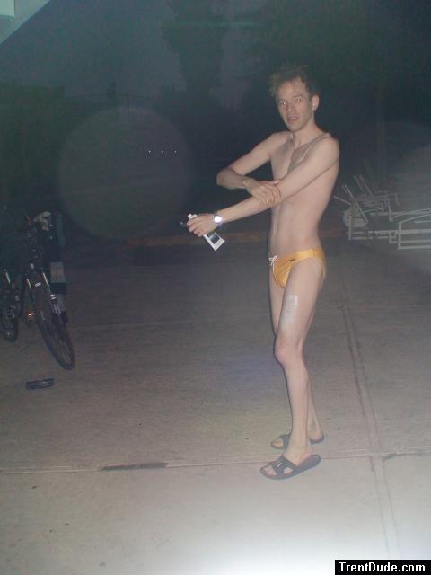 Putting anti-chlorine lotion on before a swim (yellow speedo)