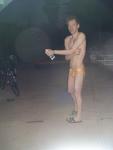 Putting anti-chlorine lotion on before a swim (yellow speedo)