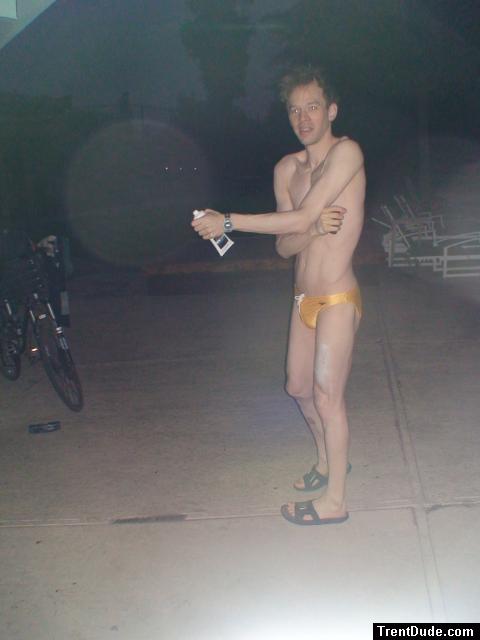 Putting anti-chlorine lotion on before a swim (yellow speedo)