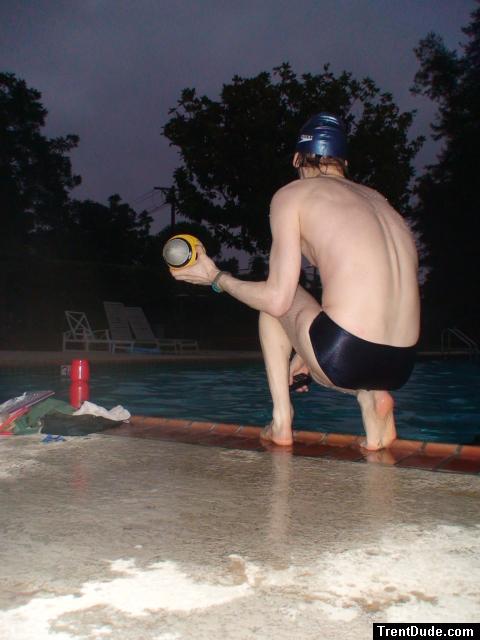 Swim team speedo size 30, playing with a football (feet)