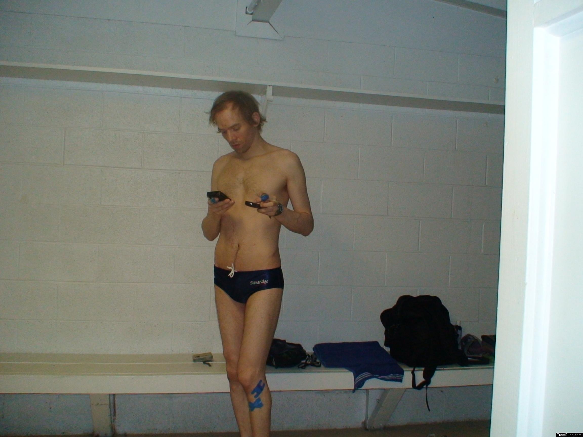 Checking his phone before leaving the locker room