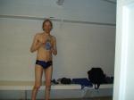 Getting ready to swim in a navy blue swim team speedo