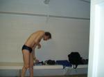 Getting ready to swim in a navy blue swim team speedo