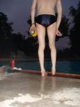 Swim team speedo size 30, playing with a football (feet) (rear)