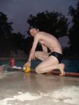 Swim team speedo size 30, playing with a football, foot