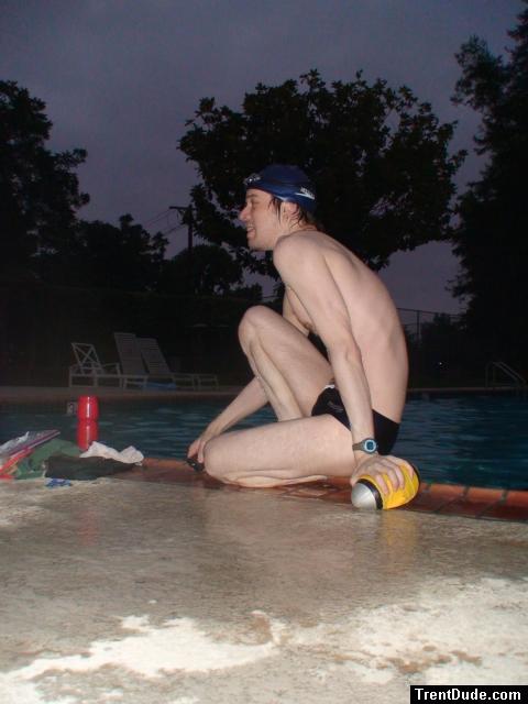 Swim team speedo size 30, relaxing next to the pool