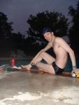 Swim team speedo size 30, relaxing next to the pool
