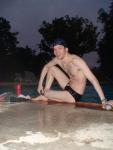 Swim team speedo size 30, relaxing next to the pool