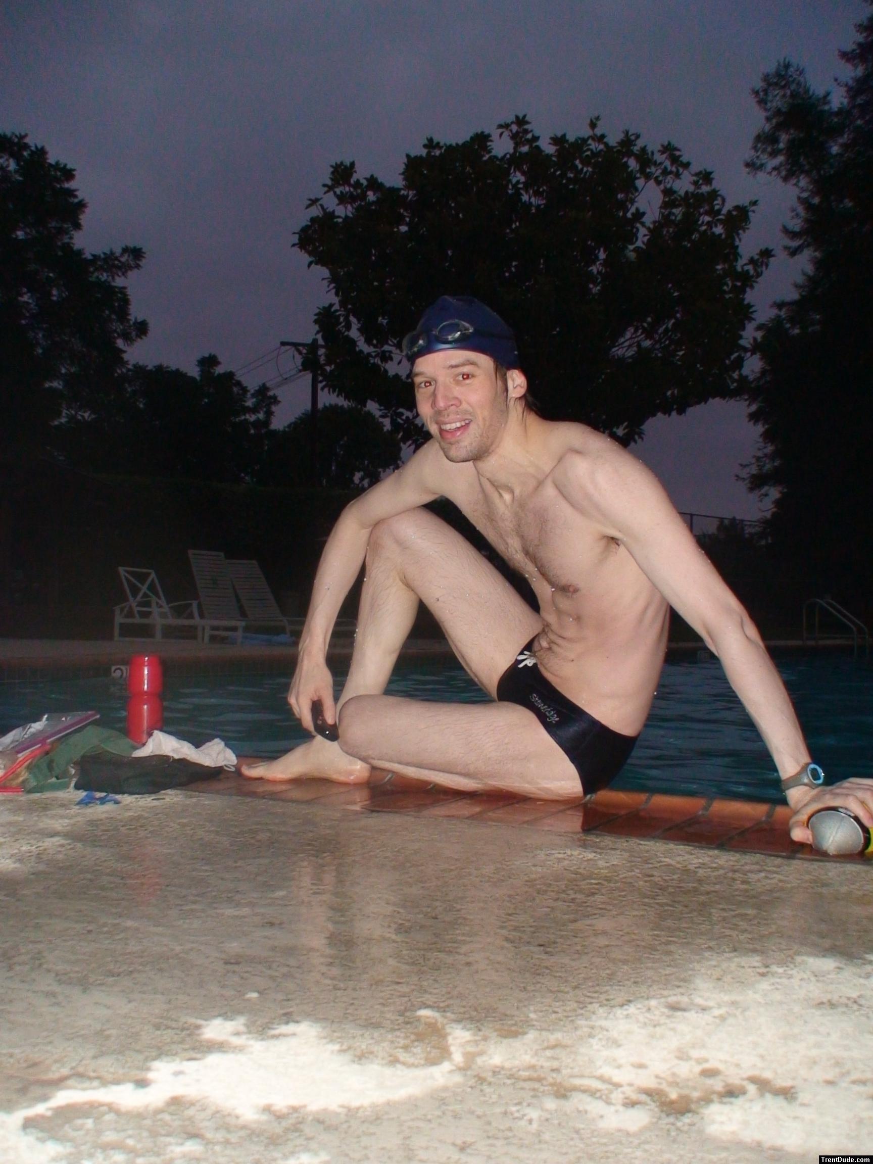 Swim team speedo size 30, relaxing next to the pool