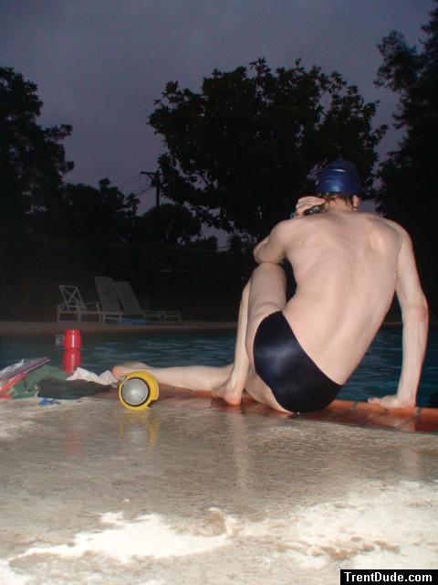 Swim team speedo size 30, relaxing next to the pool (rear)