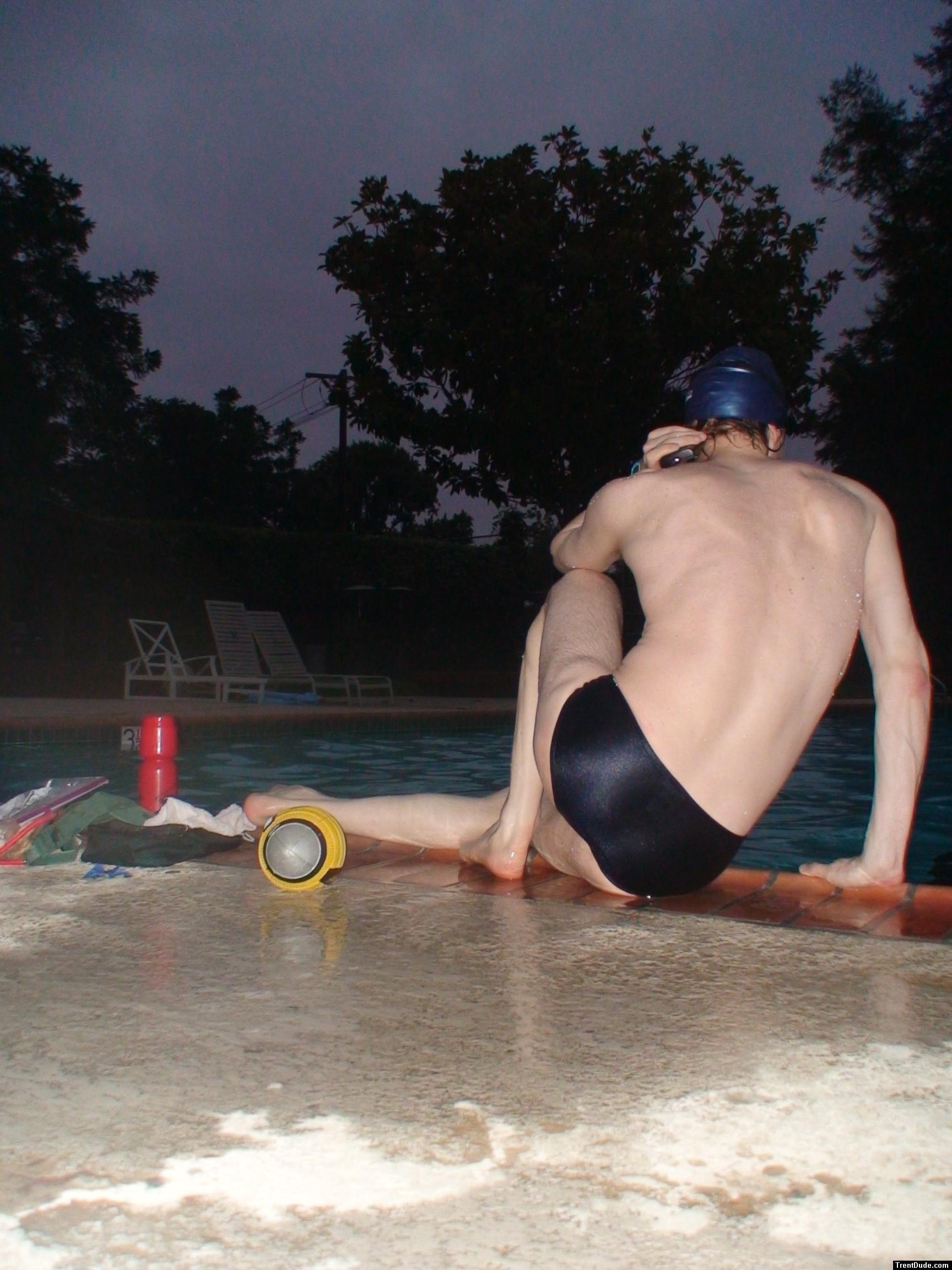 Swim team speedo size 30, relaxing next to the pool (rear)