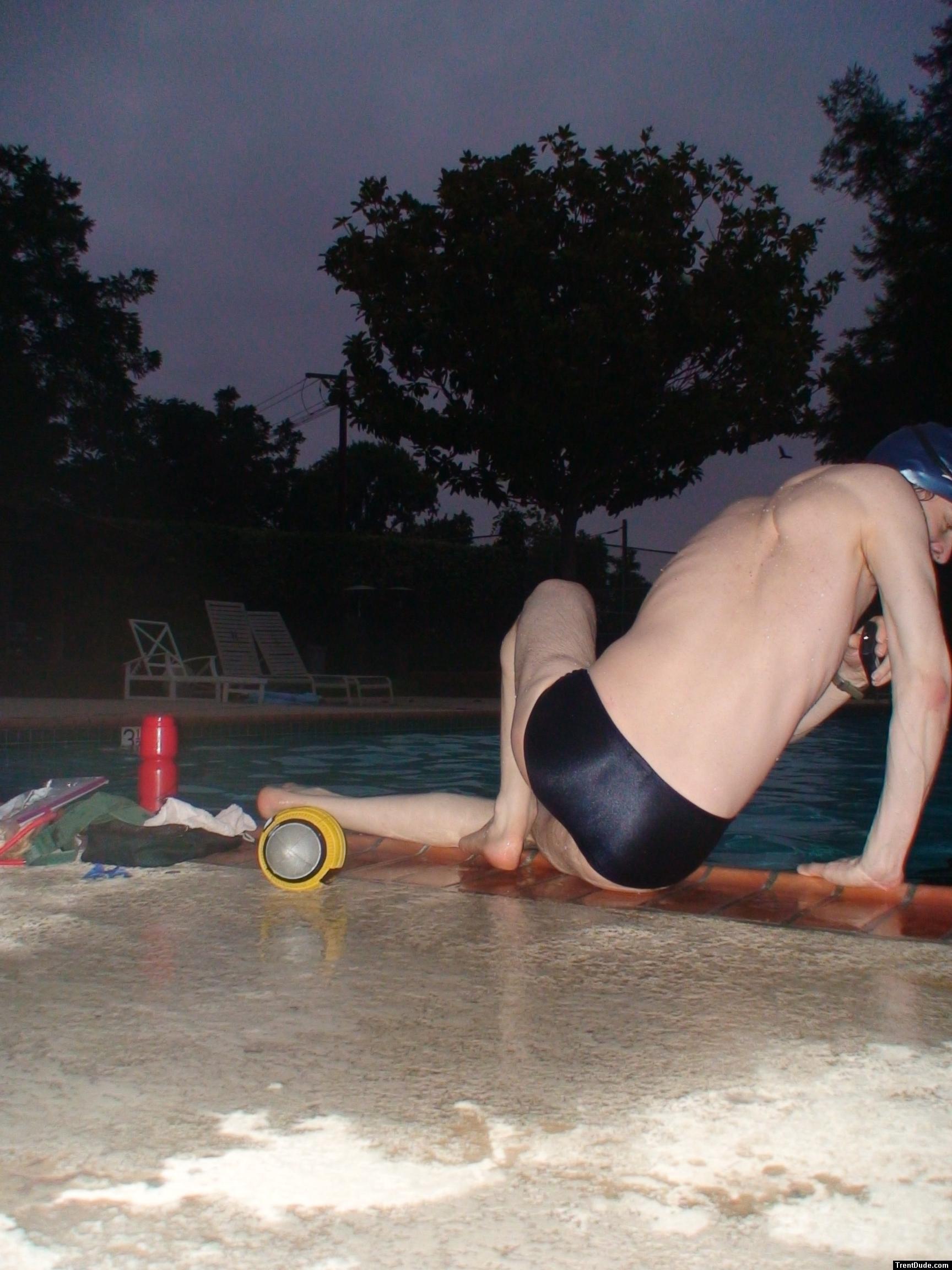 Swim team speedo size 30, relaxing next to the pool (rear)