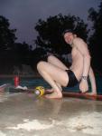 Swim team speedo size 30, relaxing next to the pool (feet)