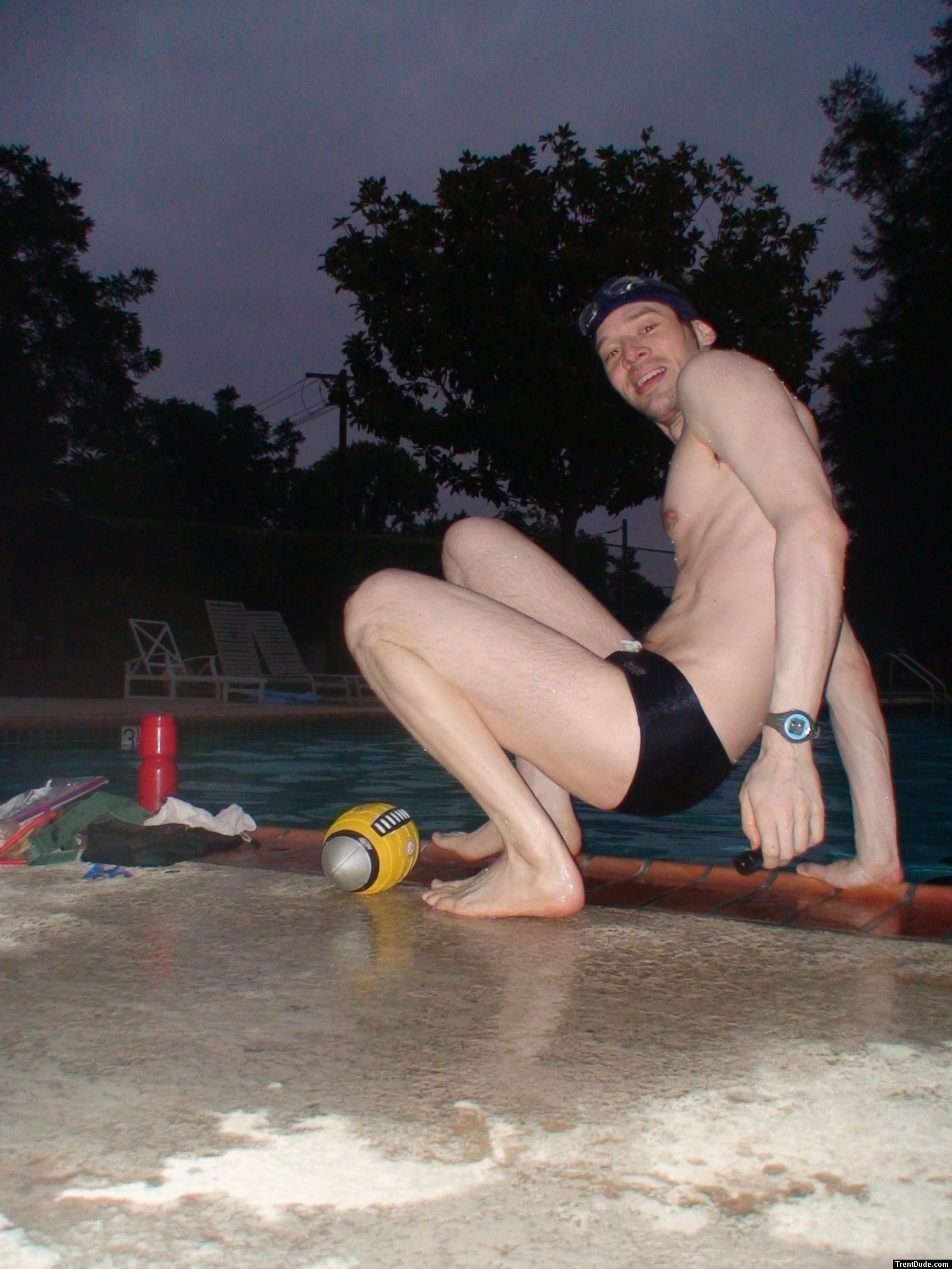 Swim team speedo size 30, relaxing next to the pool (feet)