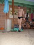 Swim team speedo size 30, next to bike