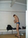 In the locker room wearing a size small swim brief, getting ready