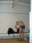 In the locker room wearing a size small swim brief, getting ready