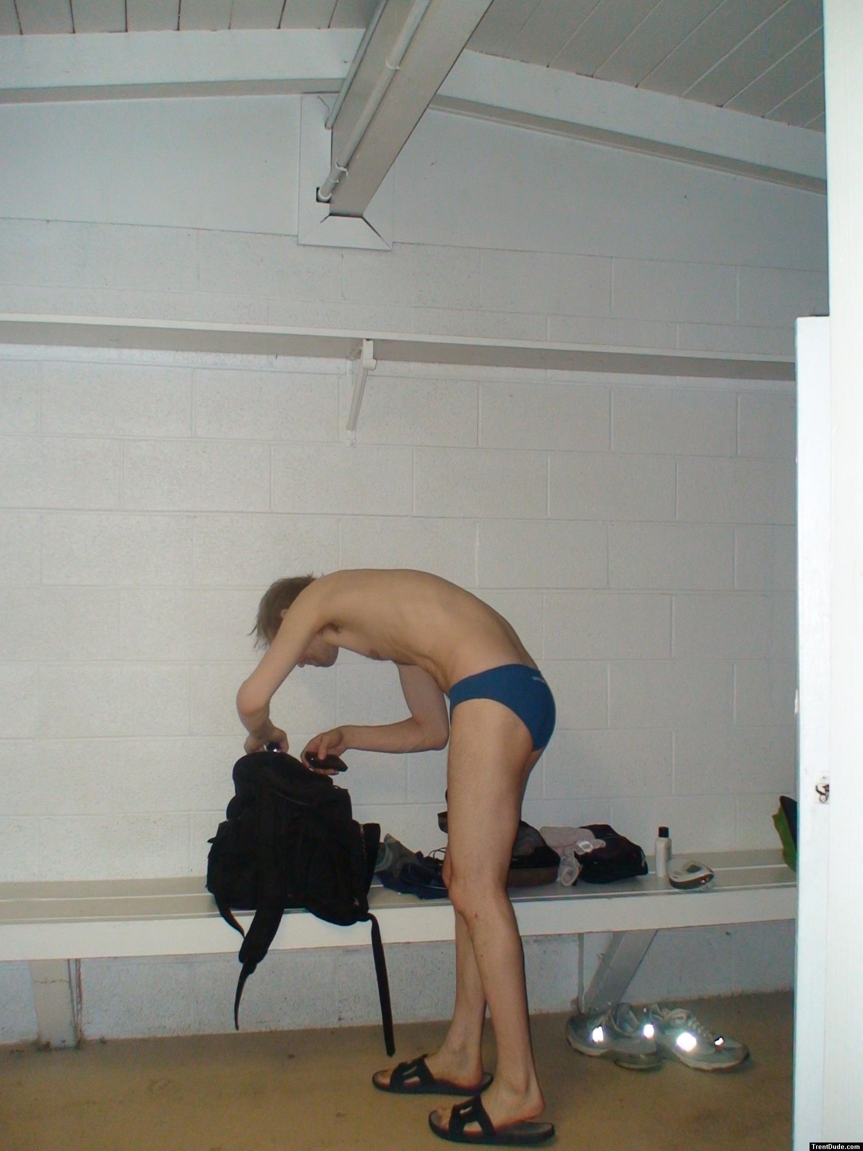 In the locker room wearing a size small swim brief, getting ready