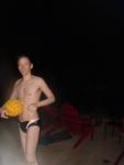 Swimmer in a speedo holding a water polo ball (smile)