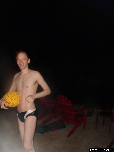 Swimmer in a speedo holding a water polo ball (smile)