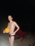 toned swimmer in a speedo holding a water polo ball (smile) (best) (abs visible after doing about 40 sit-ups per day for 1 week)