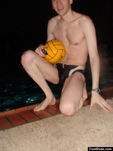 Swimmer in a speedo holding a water polo ball (feet) (chest hair)