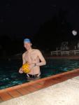 Holding a water polo ball in blue swim cap (best)