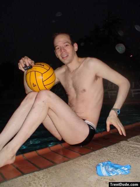 Next to the pool with a water polo ball (legs)