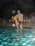 Holding a water polo ball in the rain