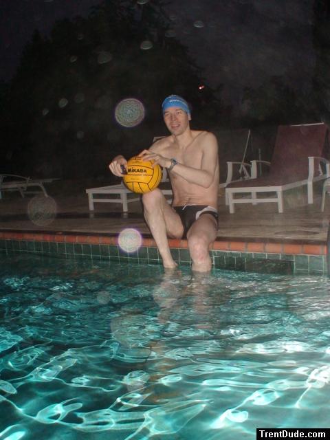 Holding a water polo ball in the rain