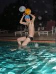 Lean swimmer about to throw a water polo ball in a black/white speedo (best)