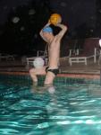 Athletic swimmer about to throw water polo ball in a black/white speedo (best) (toned)