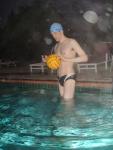 Inspecting the Water polo ball in a speedo (best).  The cap is labled www.finisinc.com