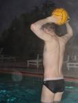Back muscles, water polo, black/white speedo (rear). To prevent back pain, he lifts a 15 lb weight off the ground and holds it o
