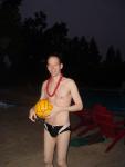 Smiling with a lei and water polo ball