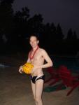 Water polo dude in black speedo and red lei