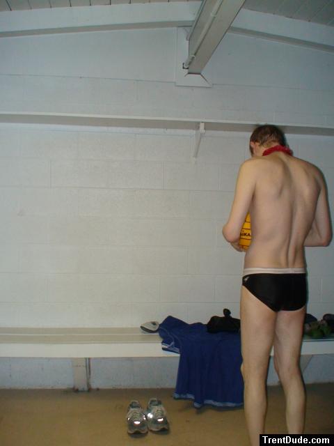 Inspecting the ball after a game in the locker room (rear)