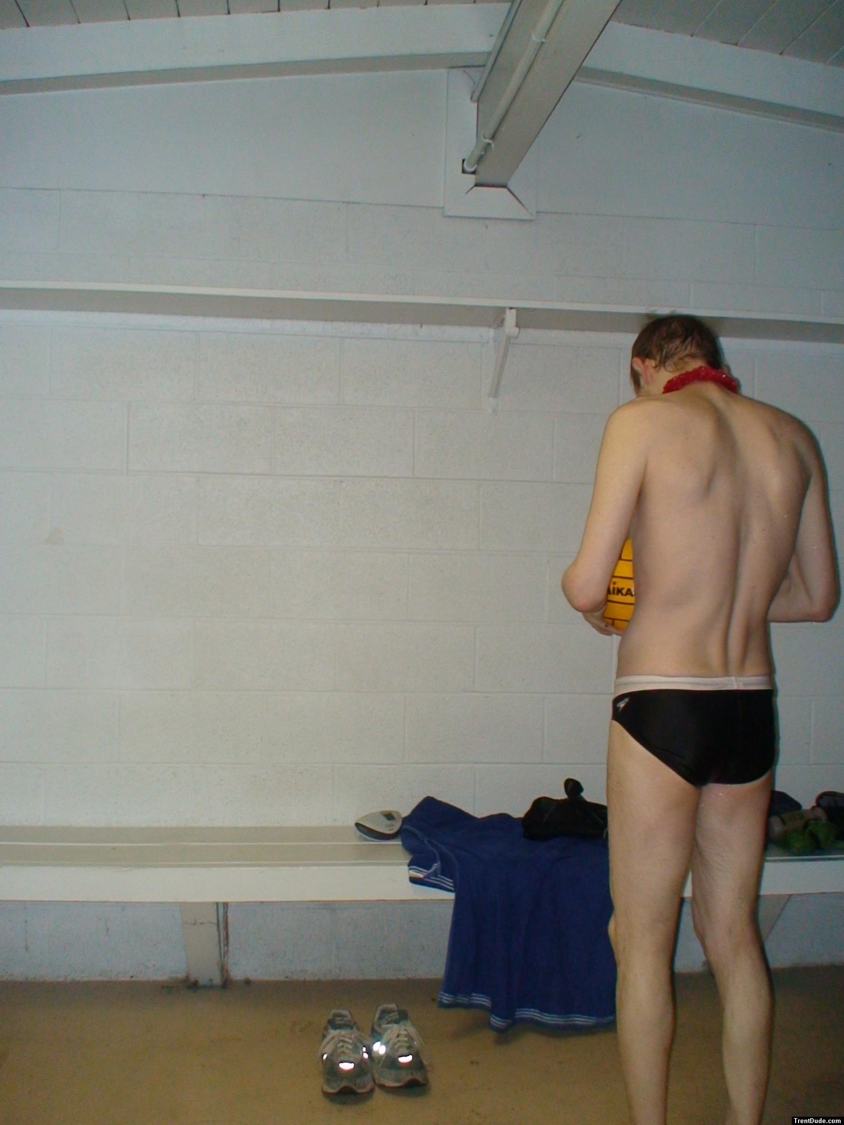 Inspecting the ball after a game in the locker room (rear)