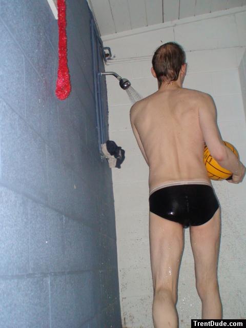 Holding the water polo ball in the shower (rear)