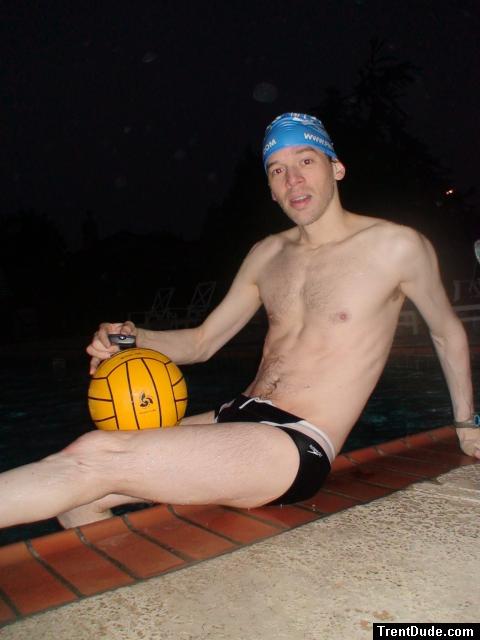 Water polo player in a speedo, blue finisinc.com swim cap