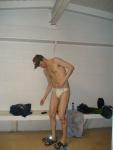 Tieing a white speedo, begin white Speedo water polo photo shoot