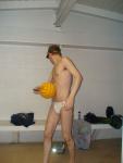 Looking over his shoulder in a white Speedo