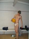Checking his feet while wearing a Green bay packers hat