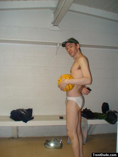 holding water polo ball, in white Speedo