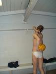 Showing off his dexter·ous·ness while wearing a white Speedo (rear)