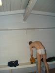 His gluteus maximus muscles in a white Speedo (rear)